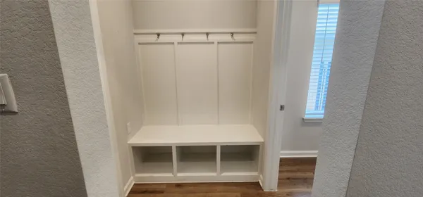 a view of a room with racks on the wall