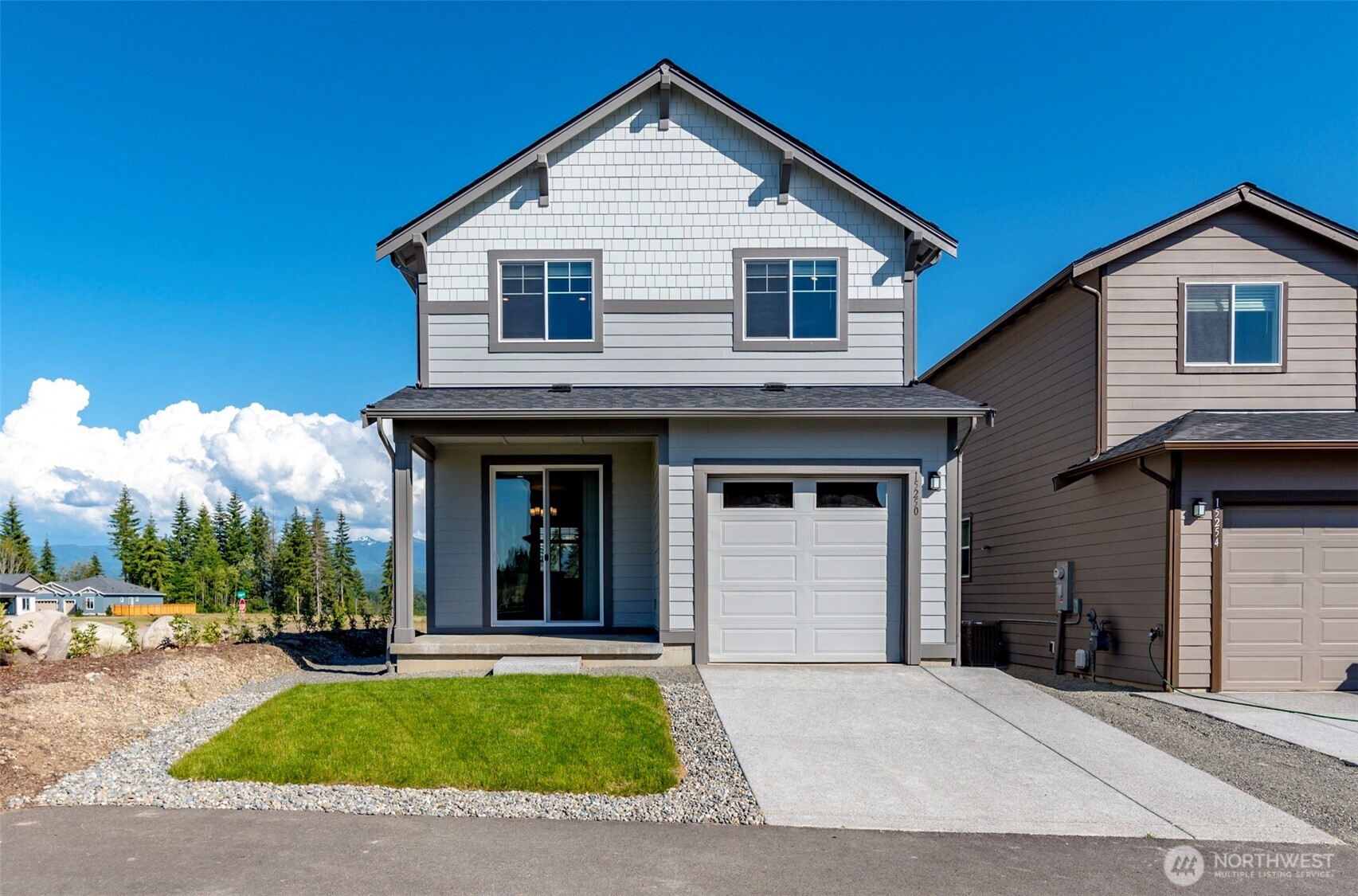 15250 208th Ave Court East Bonney Lake, WA 98391 - Photo 1 of 3 a view of a yard in front view of a house