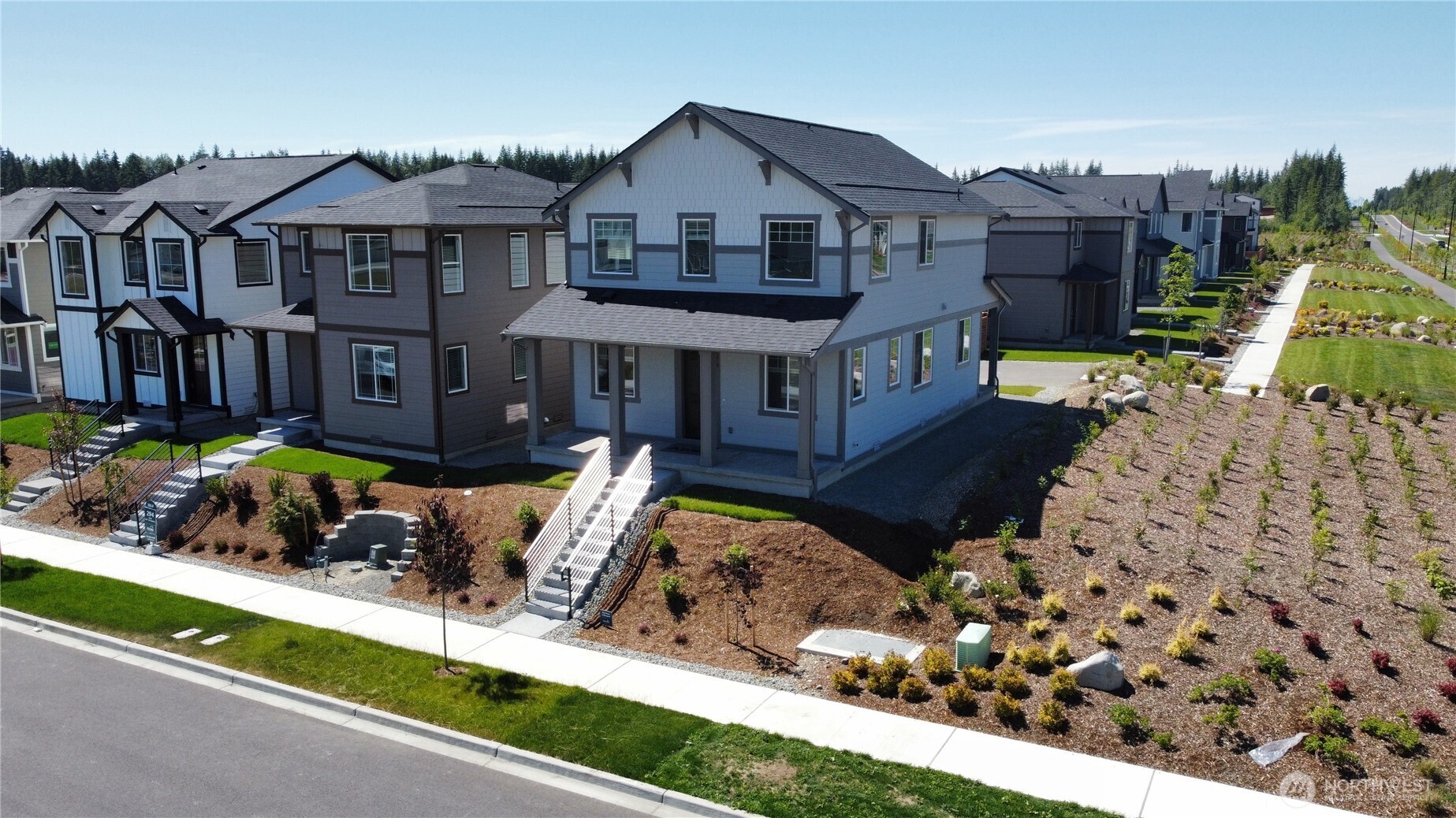 15250 208th Ave Court East Bonney Lake, WA 98391 - Photo 2 of 3 a front view of a house with a yard and potted plants