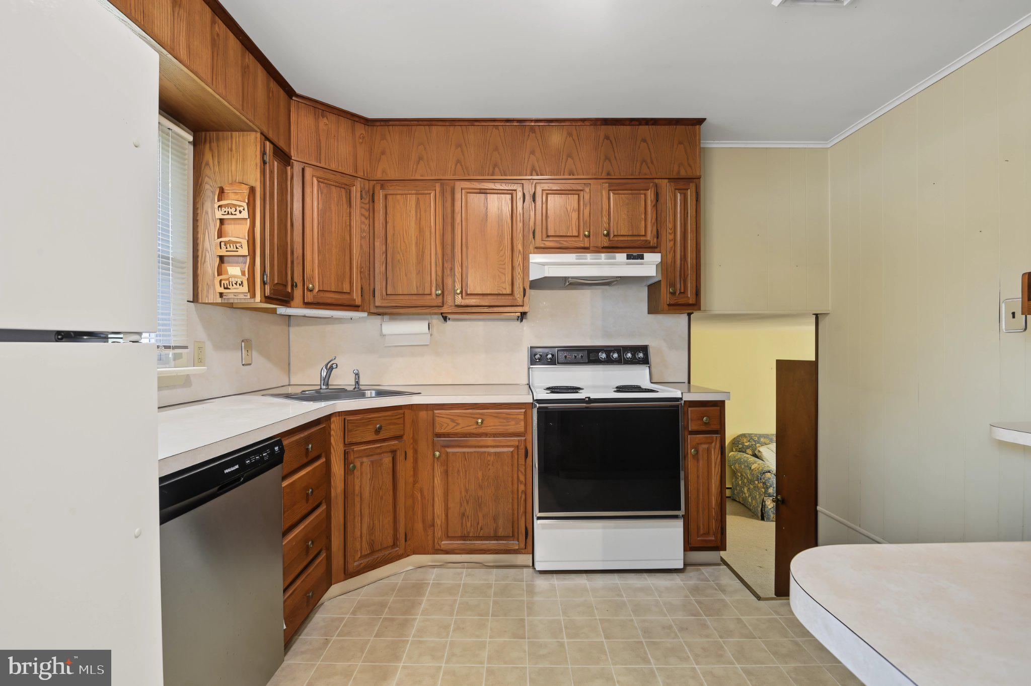 2702 Pecksniff Road Wilmington, DE 19808 - Photo 12 of 24 Cozy kitchen with warm wood accents.