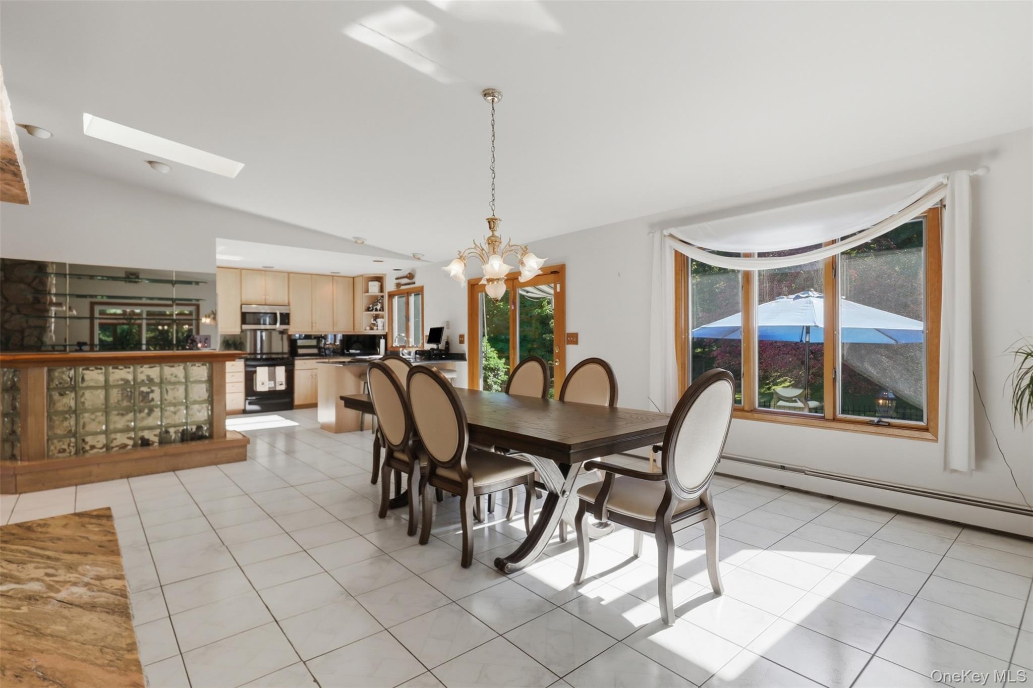 985 Craigville Road Chester, NY 10918 - Photo 12 of 36 Open-concept dining area featuring tiled flooring and a large picture window