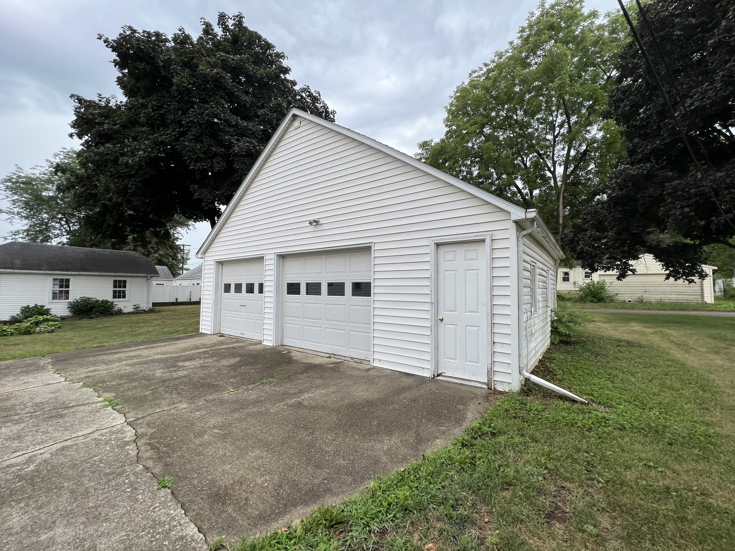 626 Woolf Court Rochelle, IL 61068 - Photo 18 of 23 a view of a house with a yard and garage