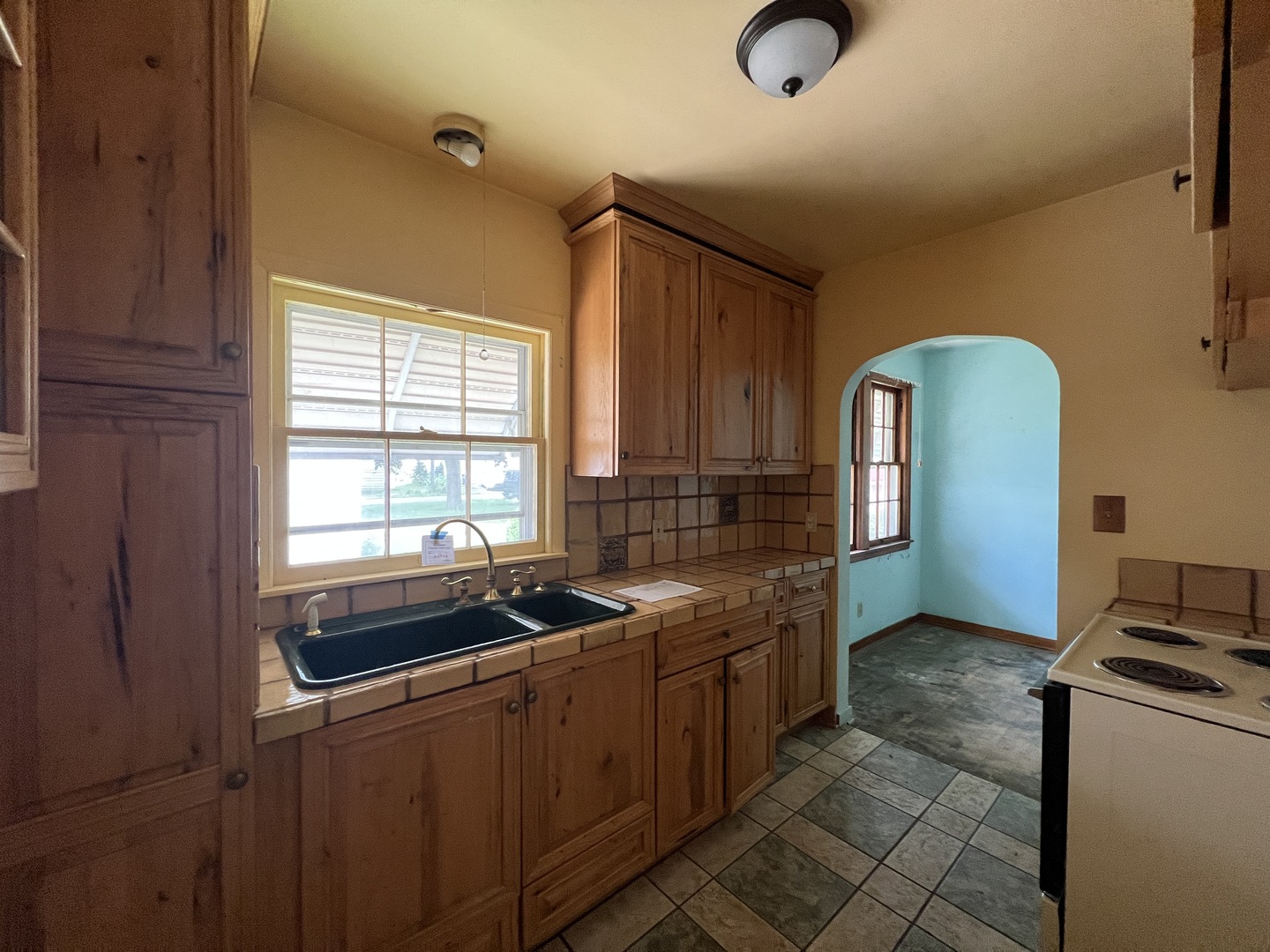626 Woolf Court Rochelle, IL 61068 - Photo 7 of 23 a kitchen with stainless steel appliances granite countertop a sink stove and cabinets