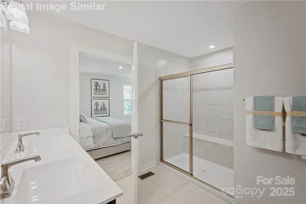 a en suite bathroom with a toilet sink and tub
