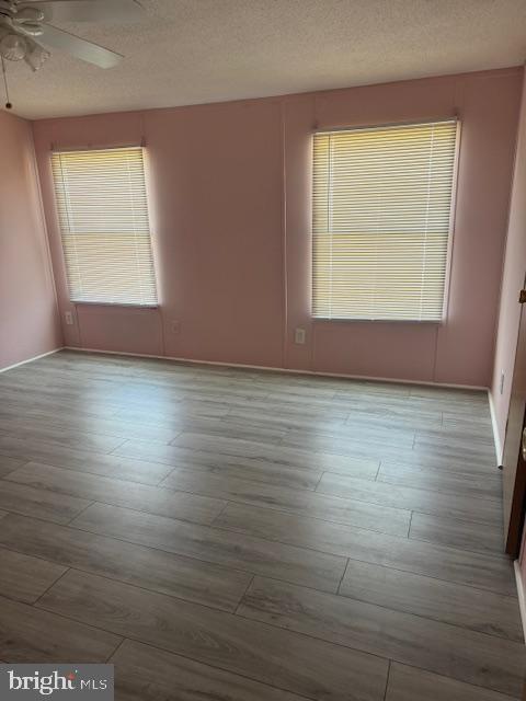 222 Poclain Road Aberdeen, MD 21001 - Photo 11 of 19 an empty room with wooden floor and windows