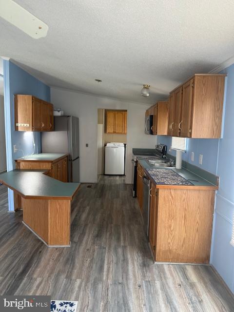 222 Poclain Road Aberdeen, MD 21001 - Photo 9 of 19 a kitchen with wooden floors and wooden cabinets