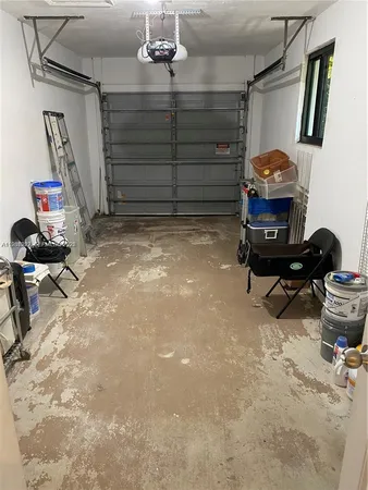a view of a livingroom with furniture and gym equipment