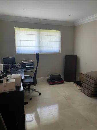 a workspace with furniture and a window