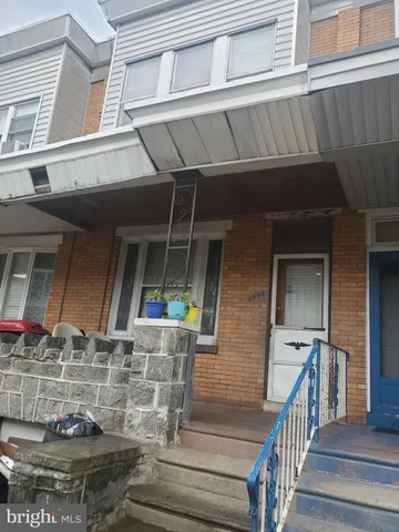 a view of house with roof deck