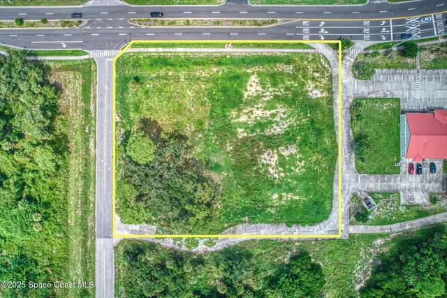 a view of a swimming pool with a yard