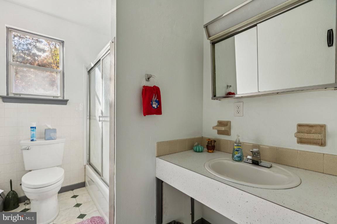 207 Sooy Place Road Tabernacle, NJ 08088 - Photo 9 of 25 a bathroom with a sink a toilet and a mirror