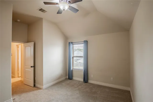 a bathroom with a granite countertop sink toilet mirror and shower