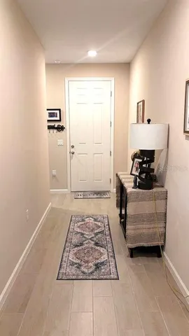 a kitchen with a sink a stove and chairs