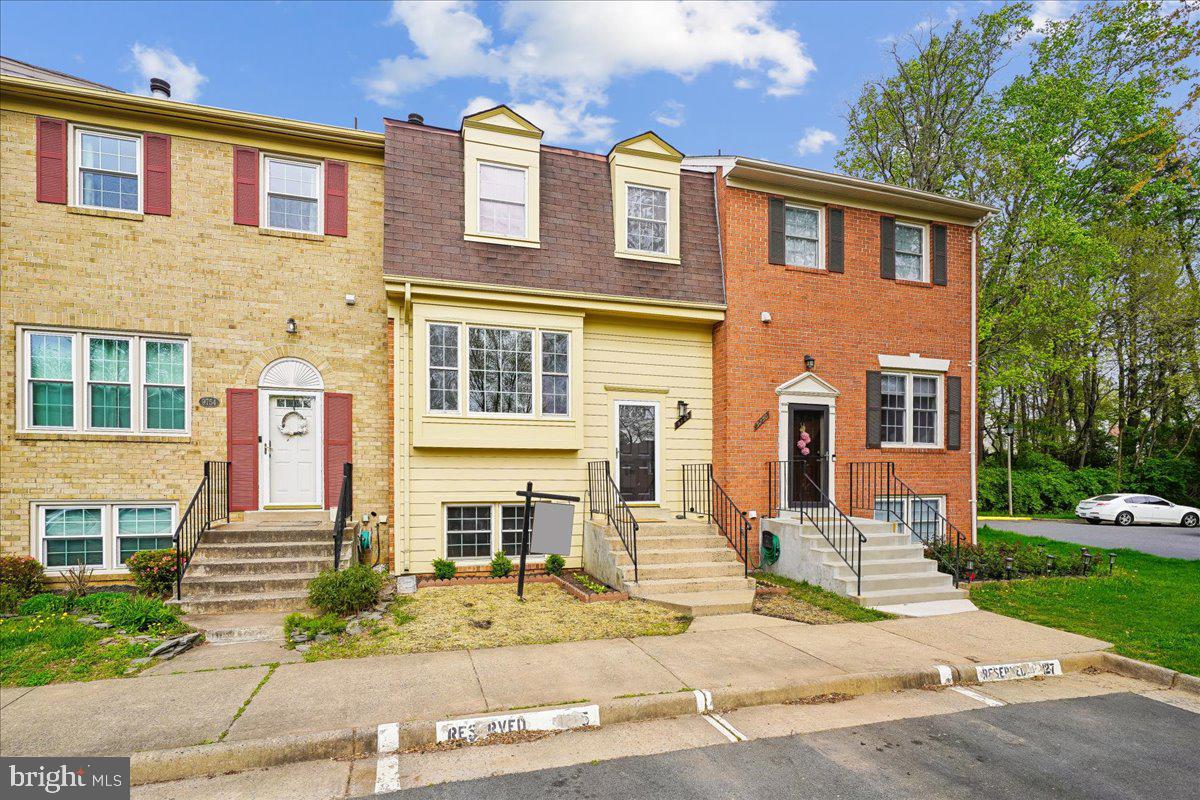 9752 High Water Court Burke, VA 22015 - Photo 1 of 25 a front view of a house with a yard