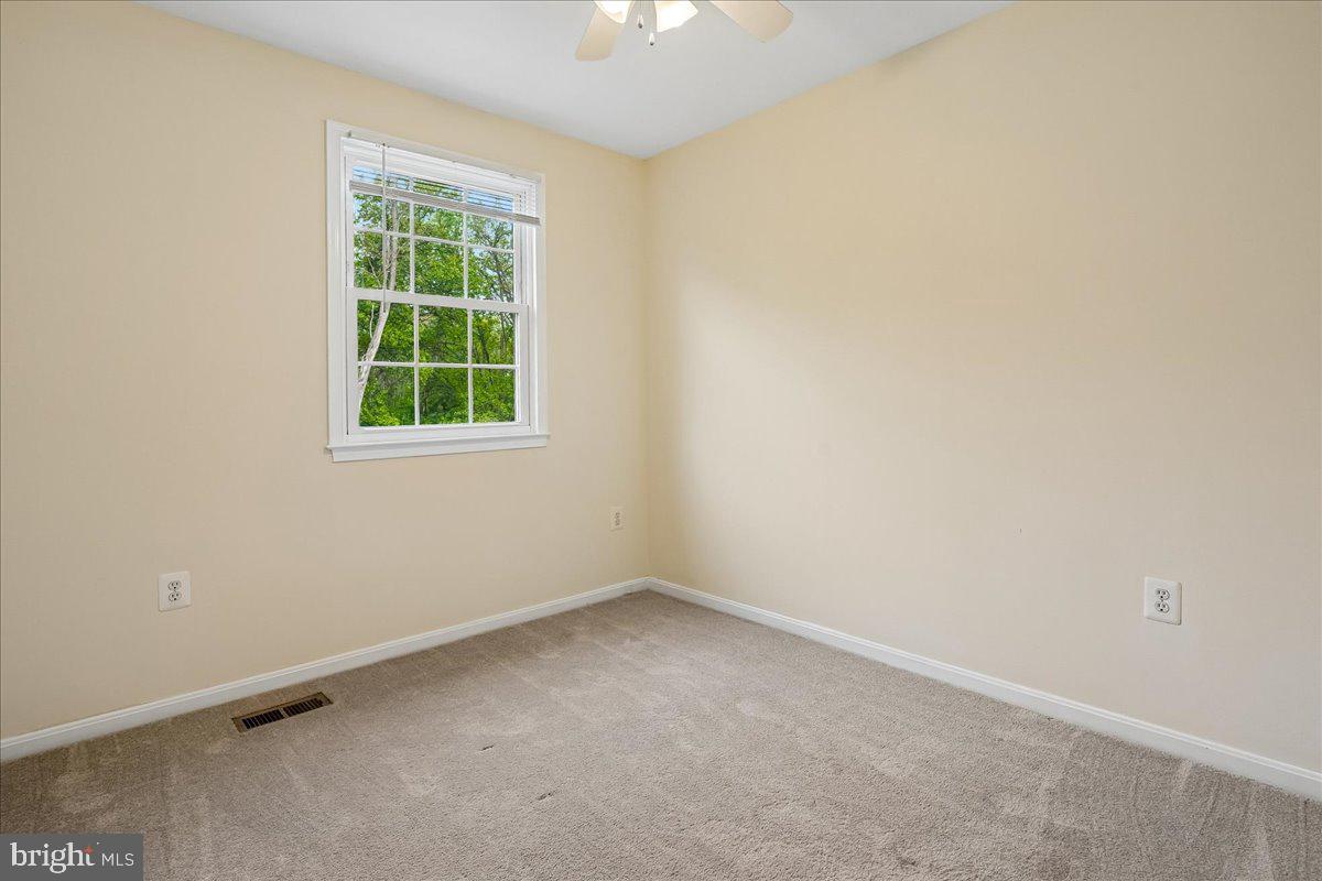 9752 High Water Court Burke, VA 22015 - Photo 11 of 25 an empty room with a window