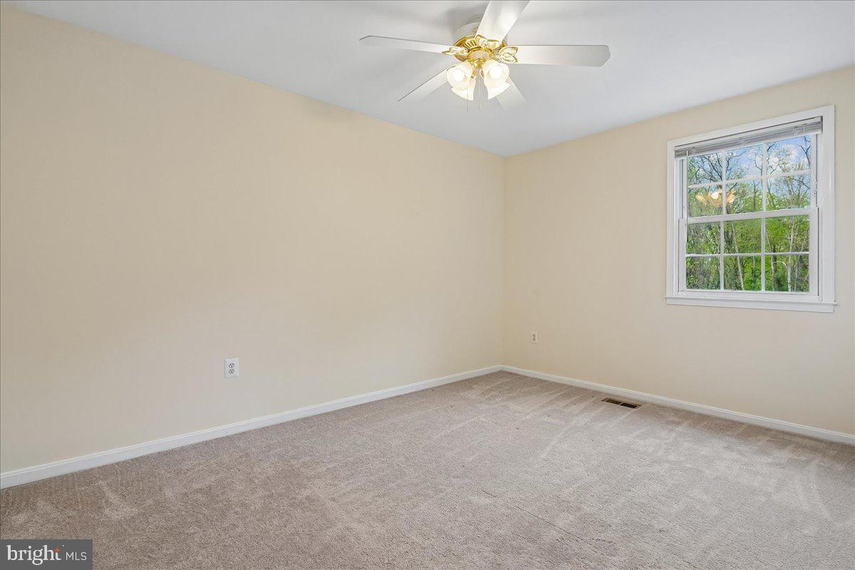 9752 High Water Court Burke, VA 22015 - Photo 13 of 25 an empty room with a window
