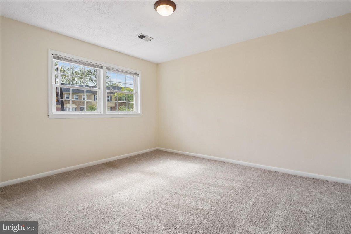 9752 High Water Court Burke, VA 22015 - Photo 18 of 25 an empty room with a window