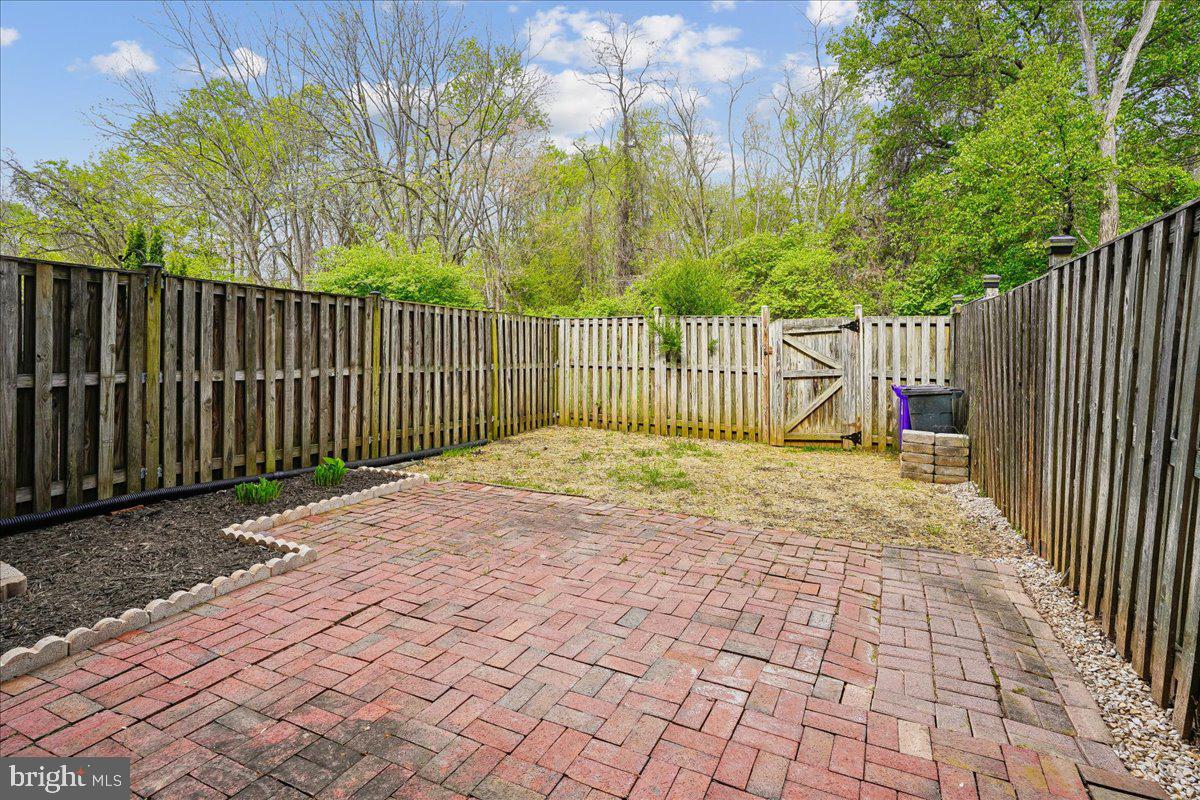 9752 High Water Court Burke, VA 22015 - Photo 21 of 25 a view of backyard with wooden fence