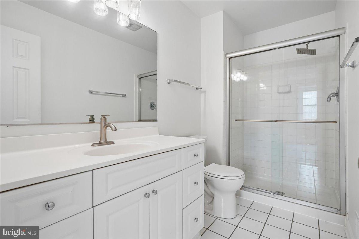 9752 High Water Court Burke, VA 22015 - Photo 10 of 25 a bathroom with a sink toilet and shower