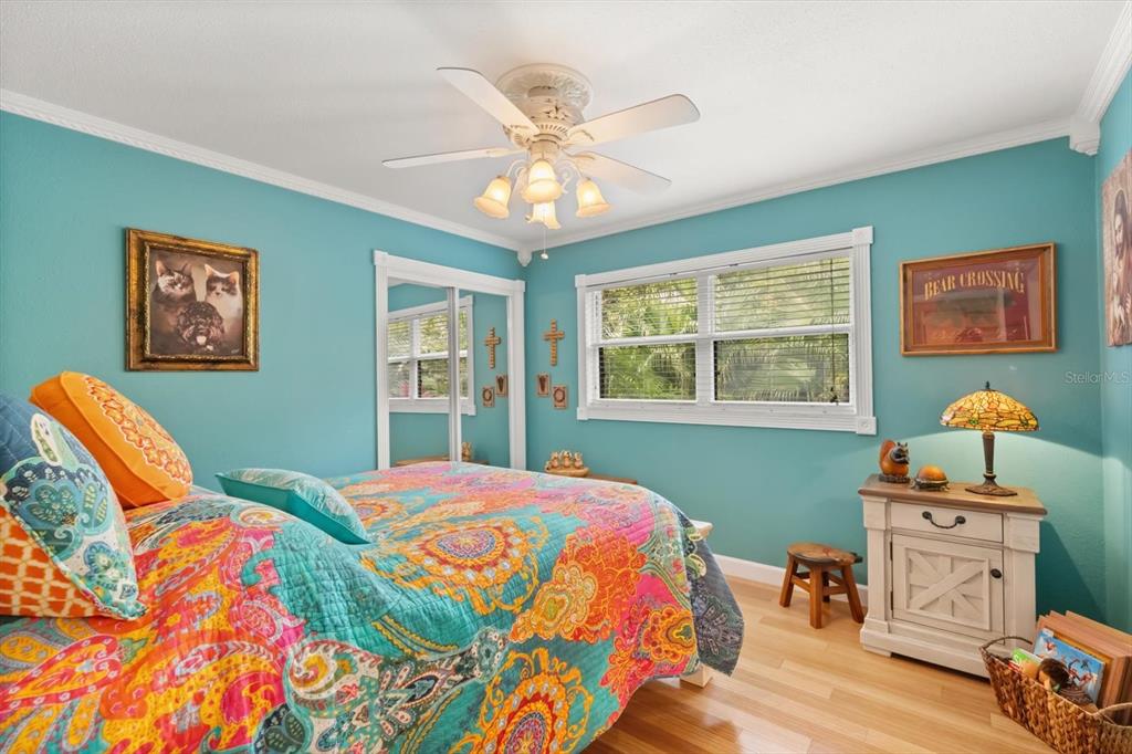4345 Corley Island Road Leesburg, FL 34748 - Photo 12 of 73 a bedroom with a bed and a window