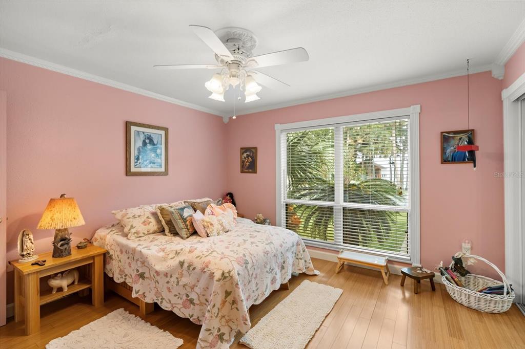 4345 Corley Island Road Leesburg, FL 34748 - Photo 15 of 73 a bedroom with a bed and a window