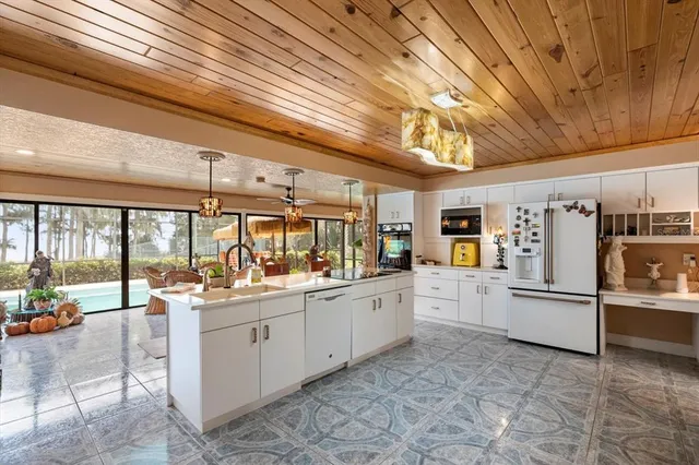 a living room with a sink cabinets and window