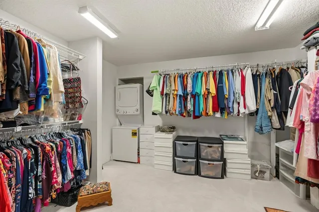a view of a patio with lawn chairs floor to ceiling window and yard