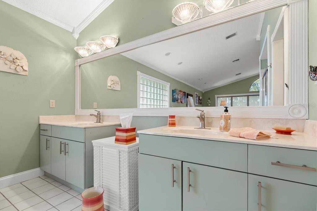 4345 Corley Island Road Leesburg, FL 34748 - Photo 34 of 73 a bathroom with a sink vanity and mirror