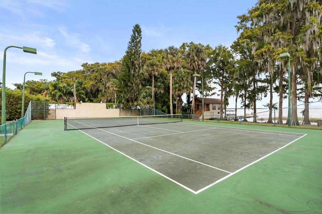 4345 Corley Island Road Leesburg, FL 34748 - Photo 41 of 73 a view of a tennis ground with large trees