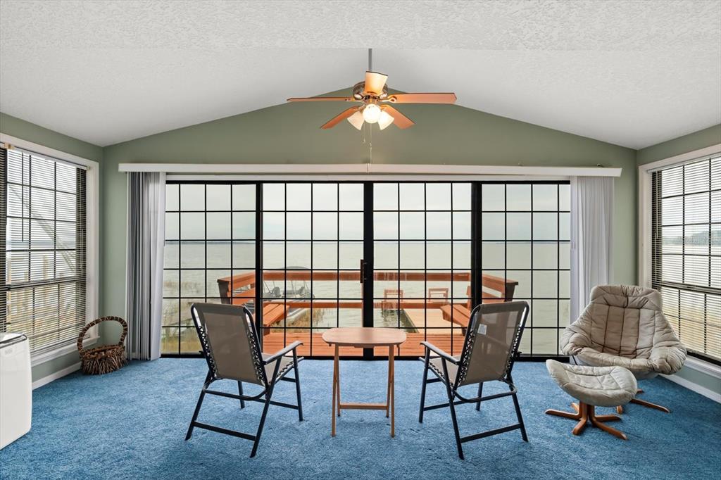 4345 Corley Island Road Leesburg, FL 34748 - Photo 48 of 73 a view of a dining room with furniture window and outside view