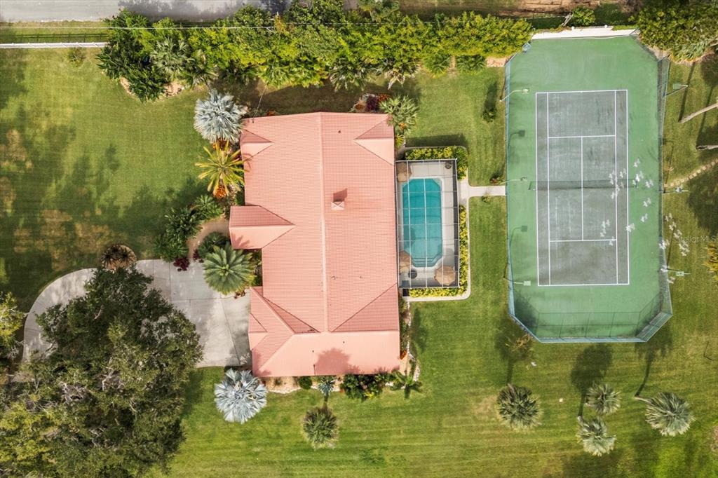 4345 Corley Island Road Leesburg, FL 34748 - Photo 66 of 73 an aerial view of a house with a swimming pool