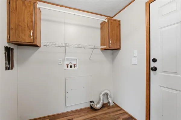 a view of an entryway with wooden floor