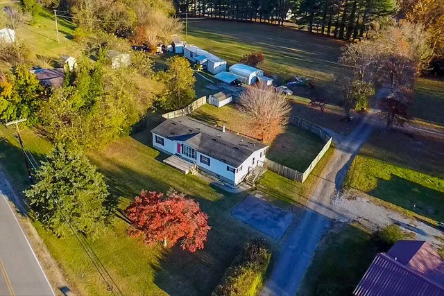 a view of a chairs and table in a backyard