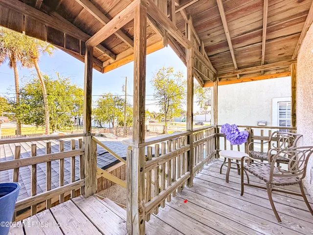 a living room with furniture and flowers