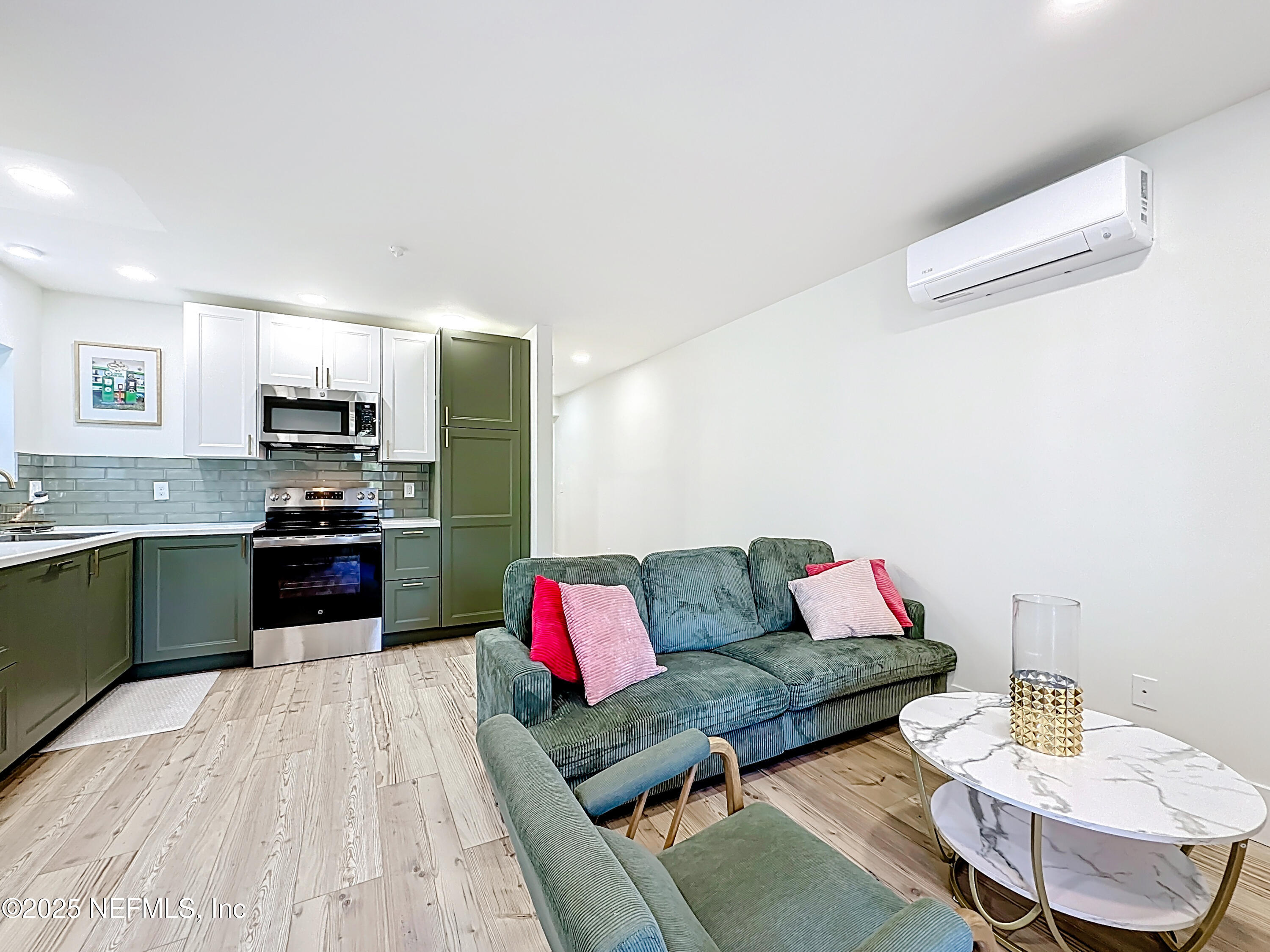 912 St Johns Avenue, Unit 101 Palatka, FL 32177 - Photo 20 of 33 a living room with furniture and kitchen