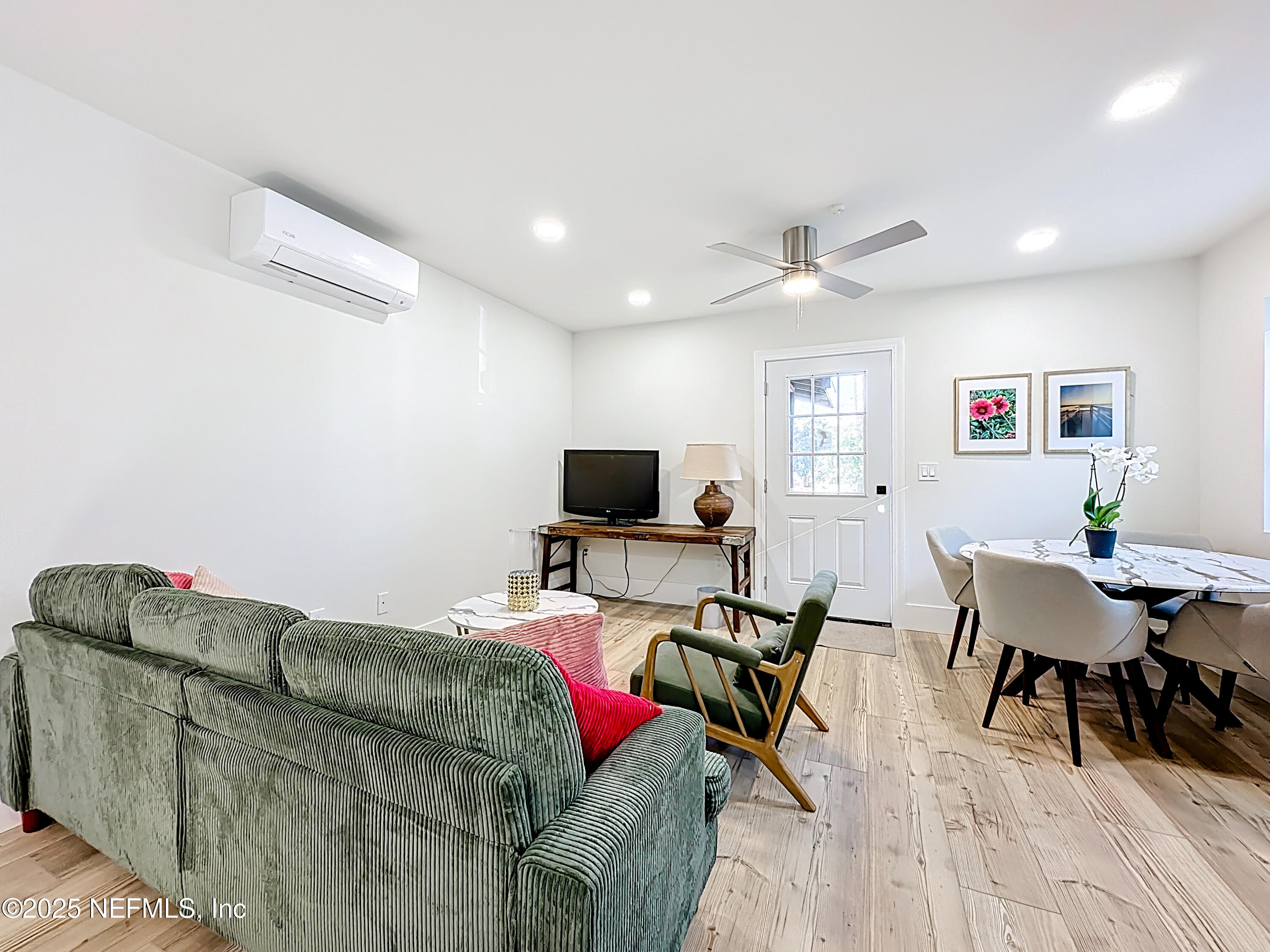912 St Johns Avenue, Unit 101 Palatka, FL 32177 - Photo 21 of 33 a living room with furniture and a flat screen tv