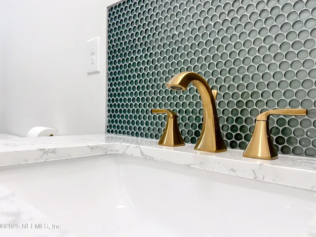 a bedroom with a bed and a ceiling fan