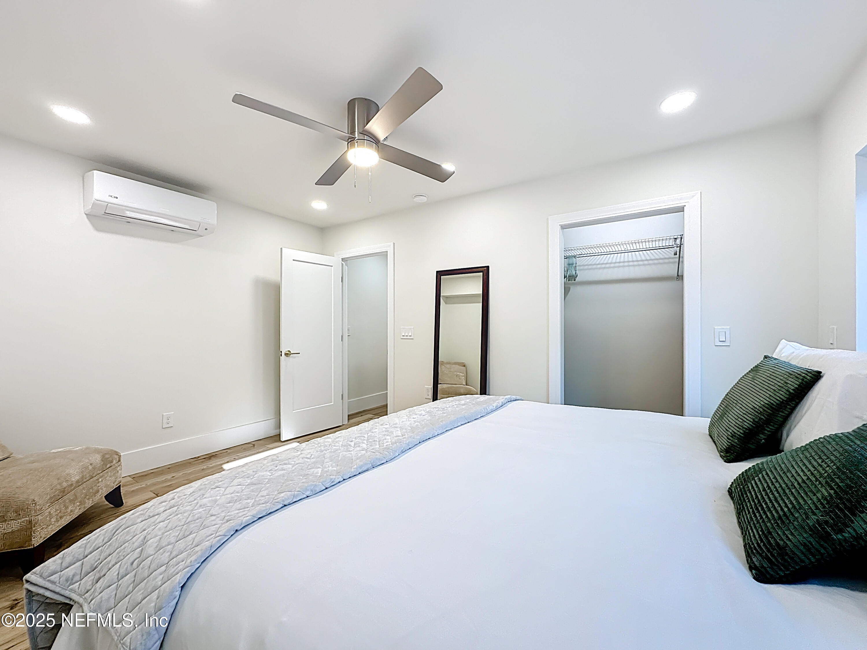 912 St Johns Avenue, Unit 101 Palatka, FL 32177 - Photo 31 of 33 a bedroom with a bed and a window