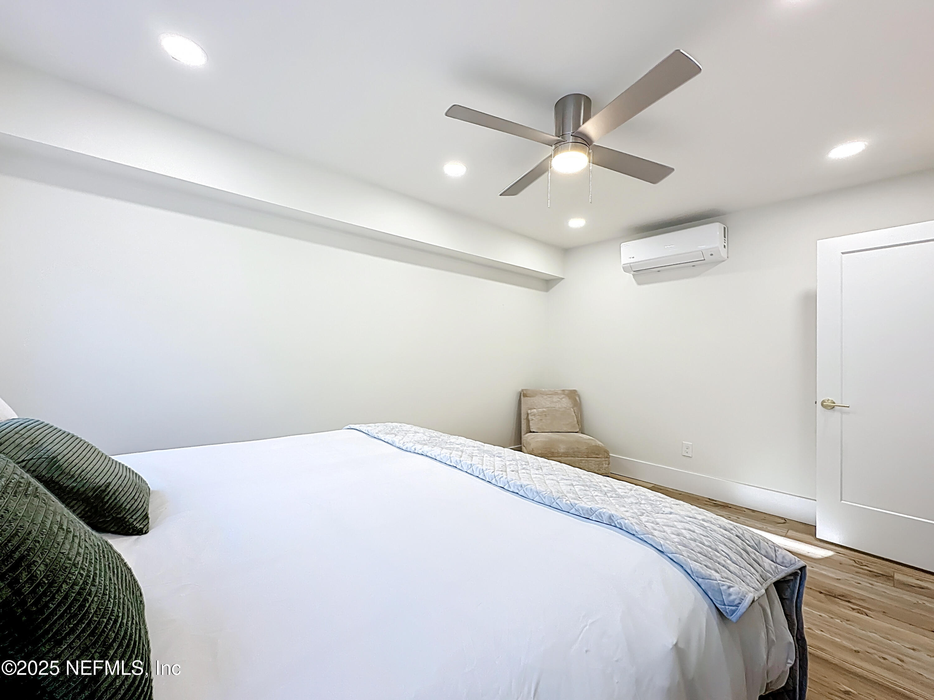912 St Johns Avenue, Unit 101 Palatka, FL 32177 - Photo 32 of 33 a bedroom with a bed and a ceiling fan