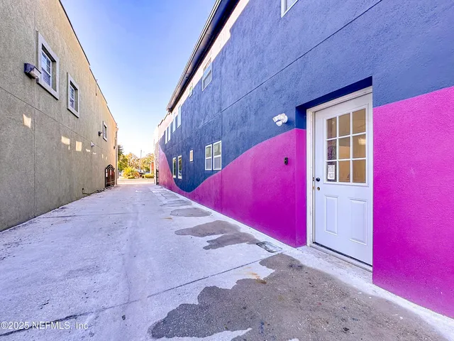 a view of a pool with red door