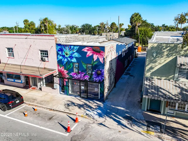 a view of a street with sitting area