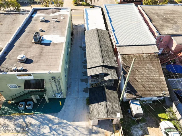 a view of balcony with wooden floor and fence