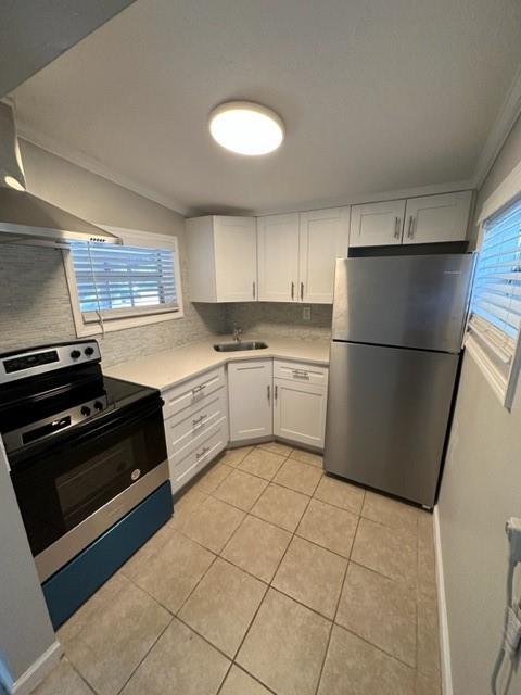 3205 Northeast 9th Street, Unit 4 Pompano Beach, FL 33062 - Photo 2 of 11 a kitchen with a cabinets and white appliances