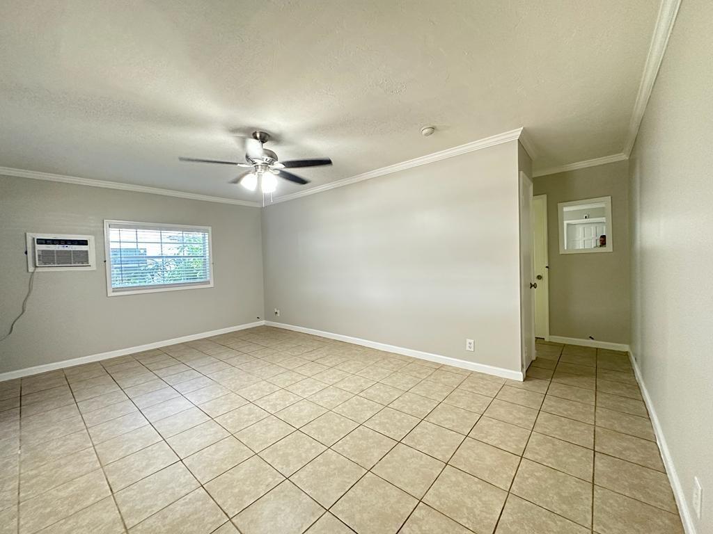 3205 Northeast 9th Street, Unit 4 Pompano Beach, FL 33062 - Photo 6 of 11 an empty room with windows and fan