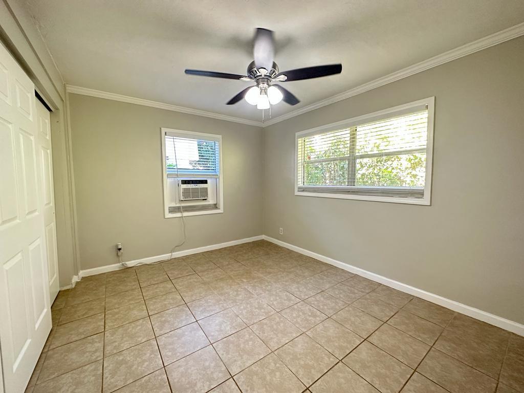 3205 Northeast 9th Street, Unit 4 Pompano Beach, FL 33062 - Photo 9 of 11 a view of an empty room and window