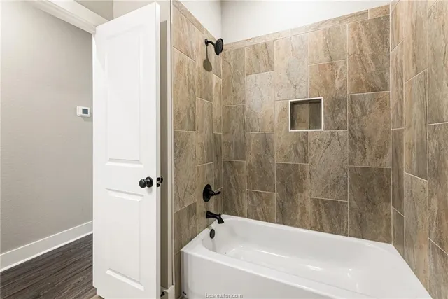 a bathroom with a shower curtain and a sink