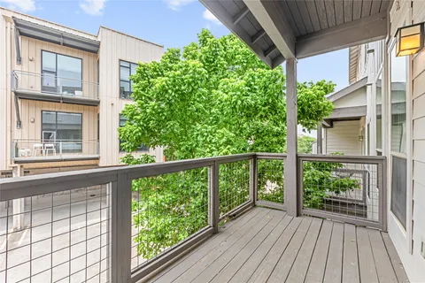 a view of a patio with couches and potted plants