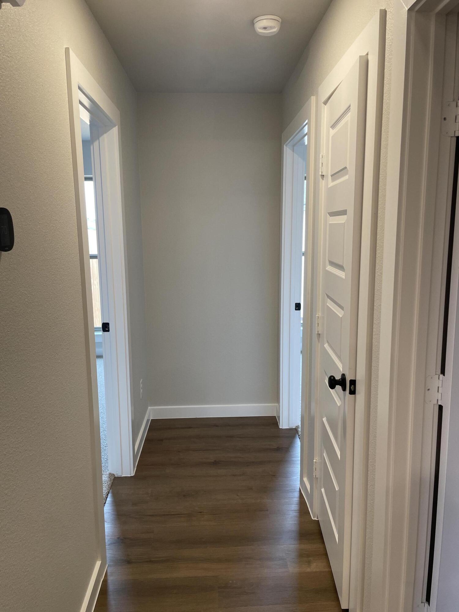 7450 29th Street Lubbock, TX 79407 - Photo 21 of 32 a view of a hallway with wooden floor