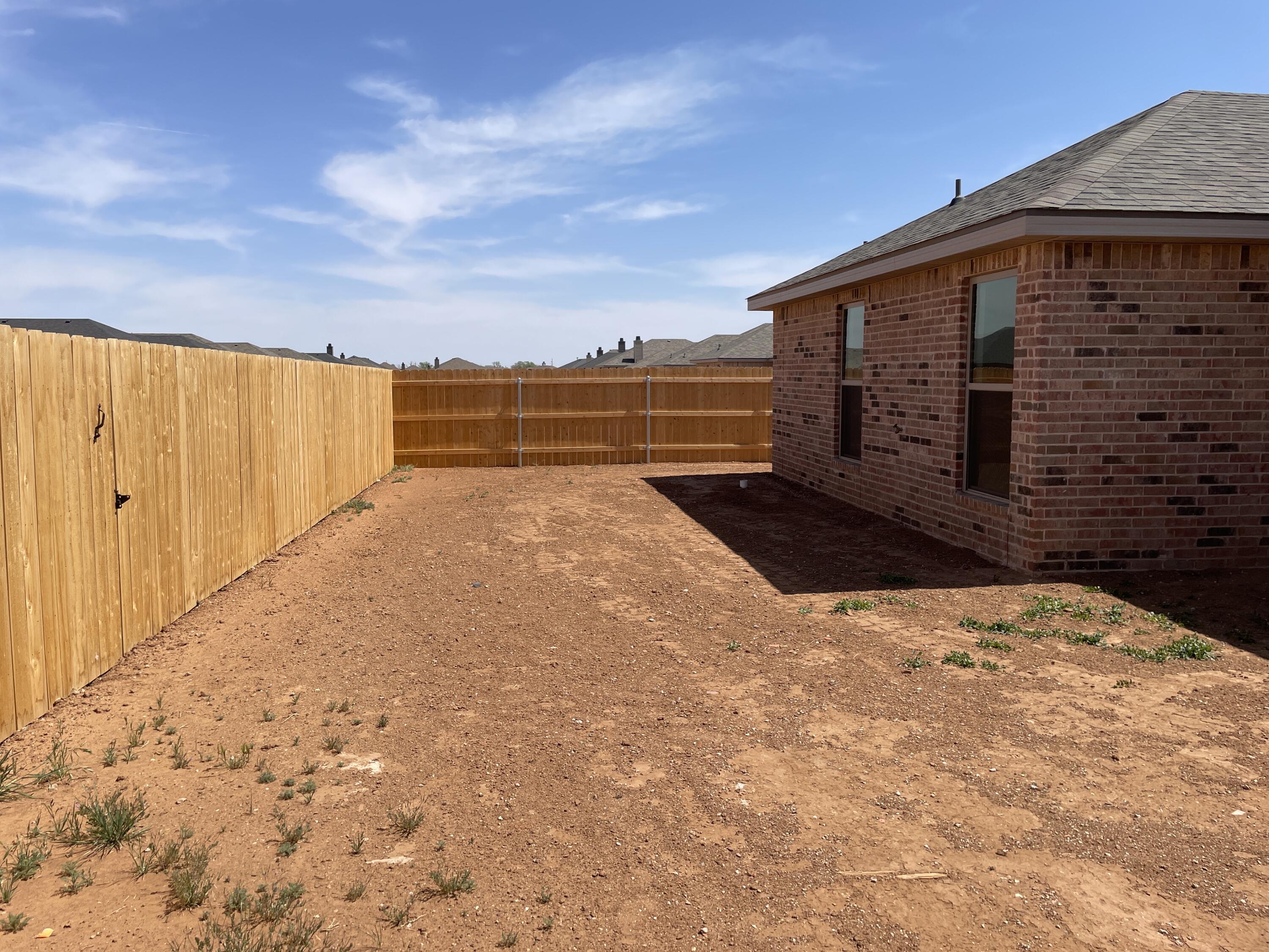 7450 29th Street Lubbock, TX 79407 - Photo 30 of 32 a view of a backyard of the house