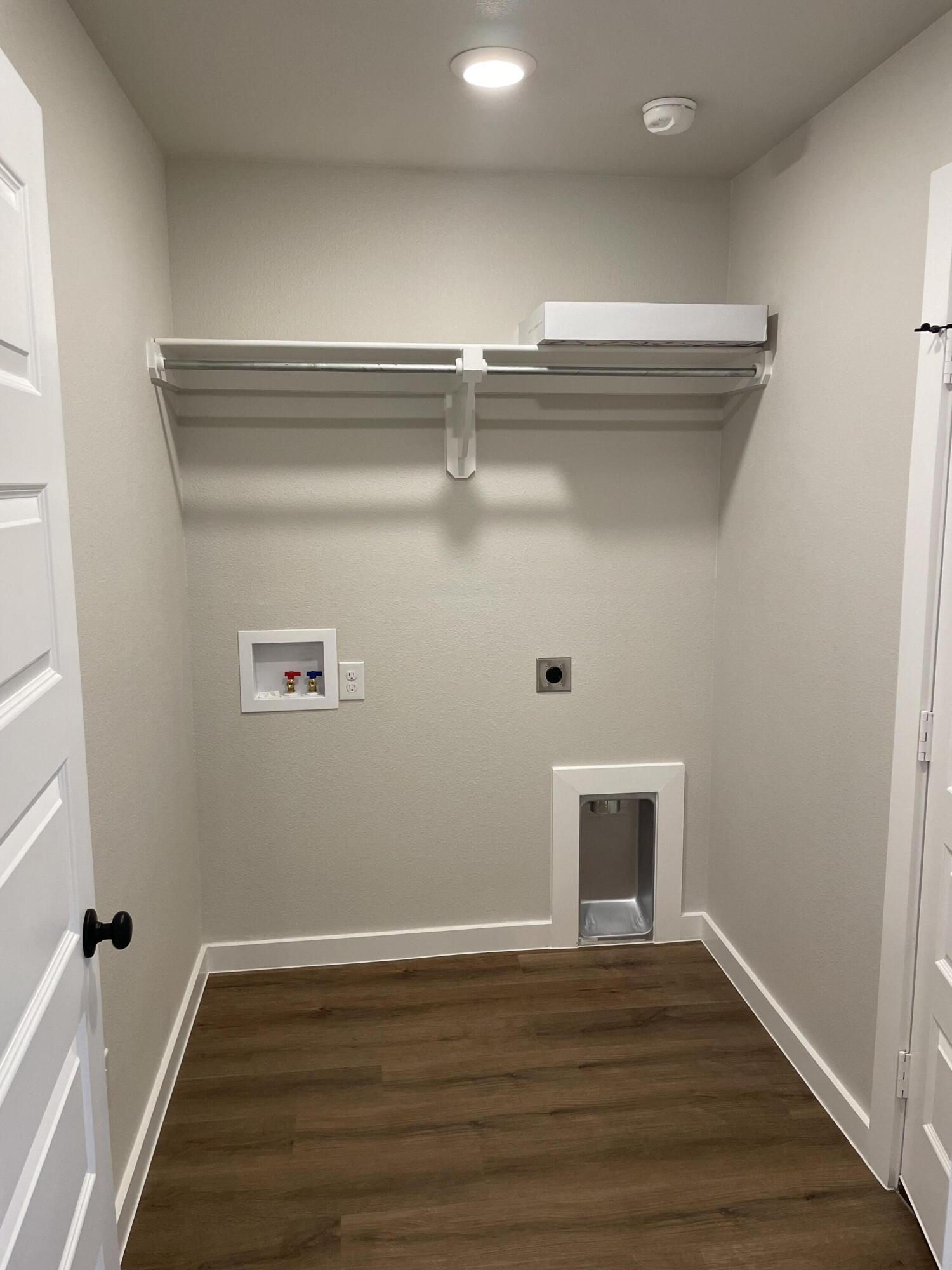 7450 29th Street Lubbock, TX 79407 - Photo 7 of 32 a view of a hallway with wooden floor